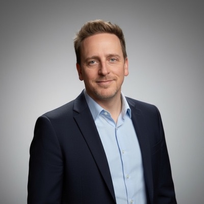 Ryan Parker, founder of ReclaimYourRev, smiling in a navy blazer